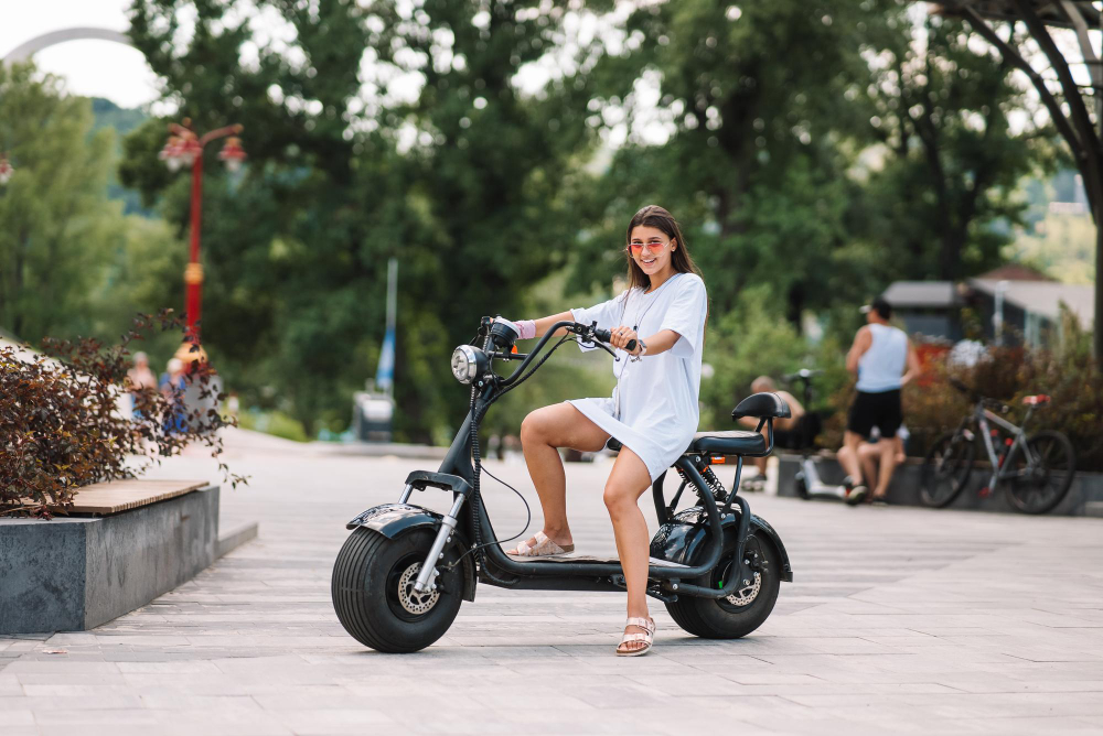 young beautiful woman electric scooter